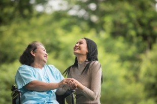 Senior receiving compassionate companion care and emotional support from a professional caregiver in Toronto.