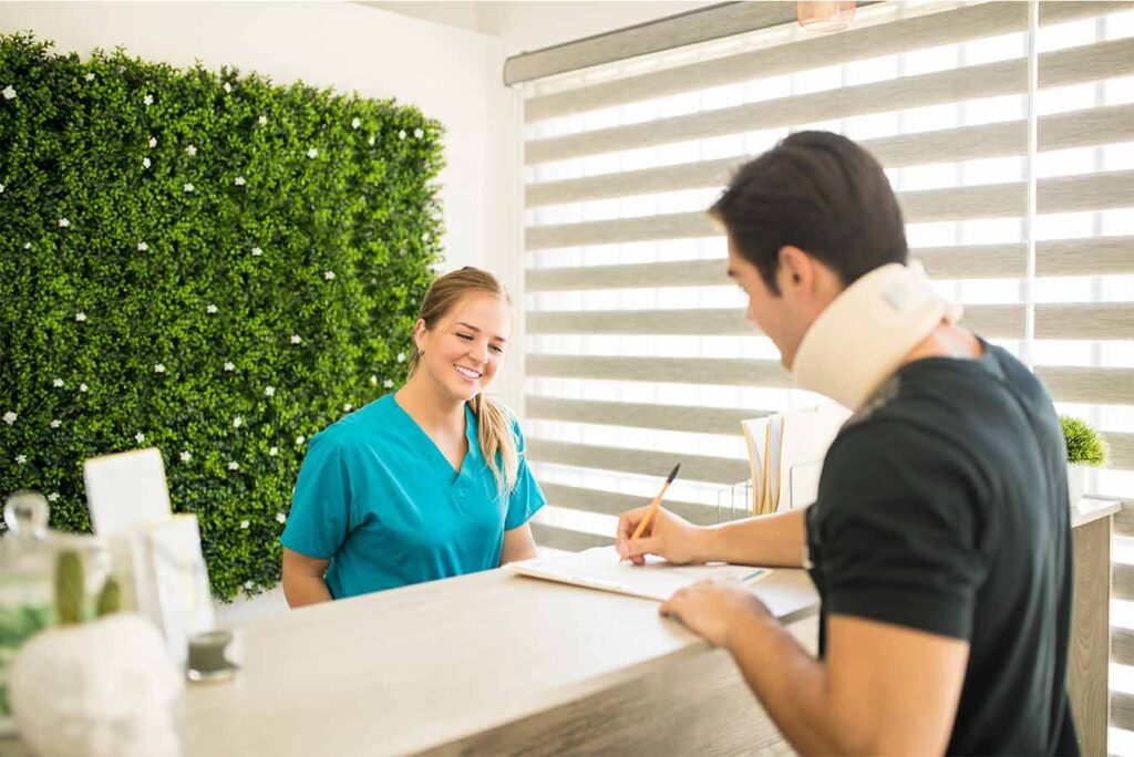 Personal support worker assisting an elderly couple with daily care in Toronto