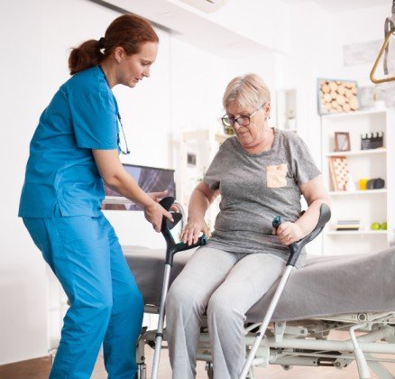 Compassionate home care caregiver assisting an elderly woman in Mississauga